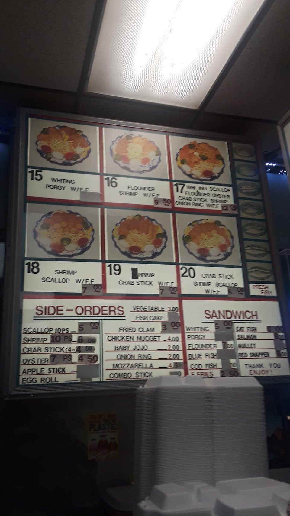 Seafood menu highlighting shrimp and scallops.